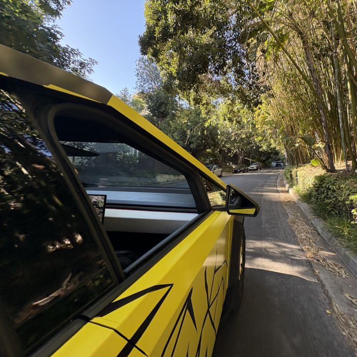 cybertruck on the road in the neighborhood of hollywood