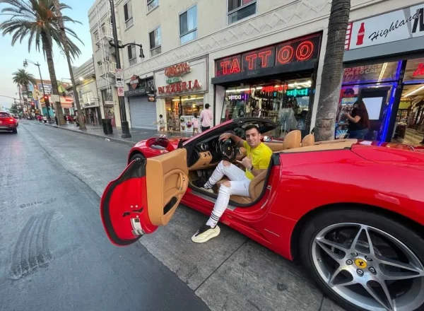 man red ferrari california t hollywood walk of fame los angeles