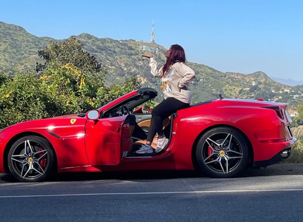 woman posing red ferrari hollywood sign things to do los angeles
